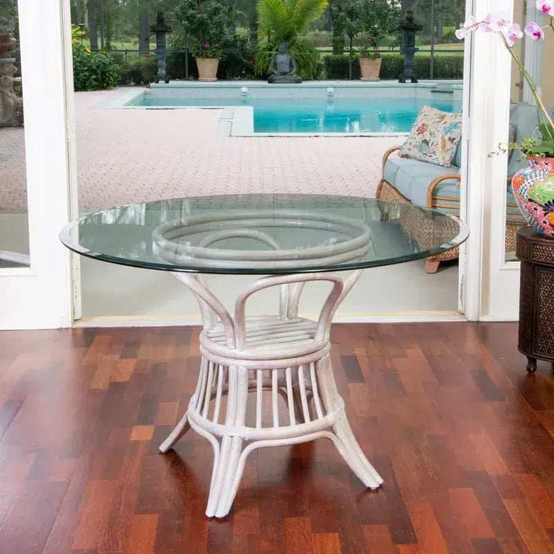 Table à manger ronde en rotin avec plateau en verre, aspect bois flotté rustique